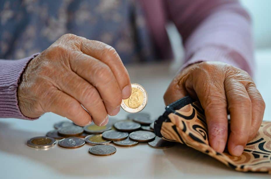 KompleteCare leading the way aged care reform elderly man counting money coins