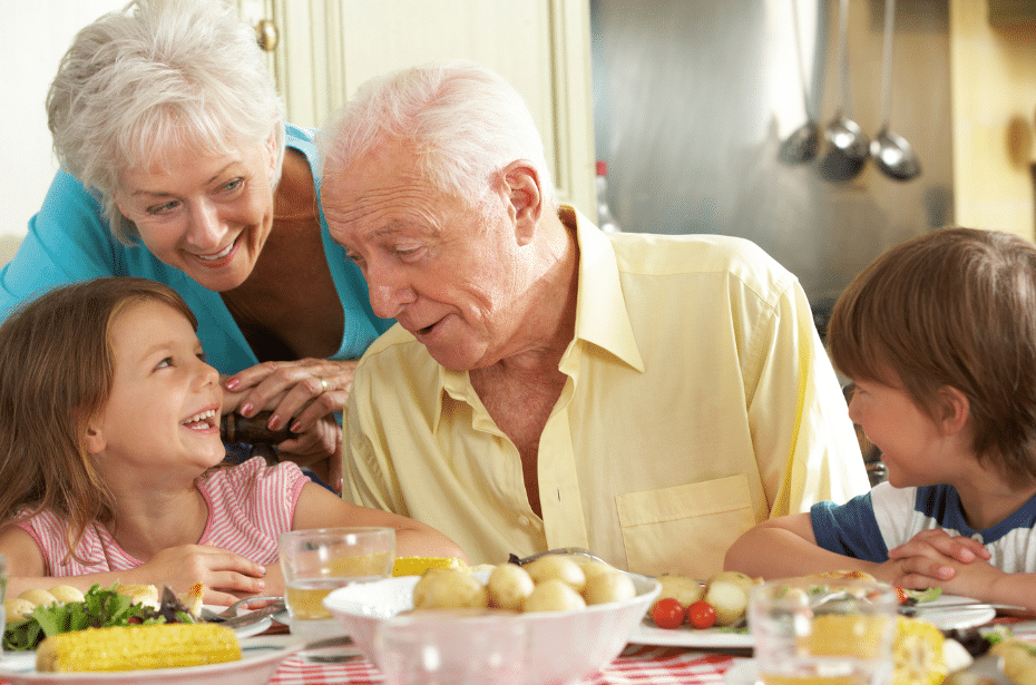 grandparents connect with grandchildren eating food table