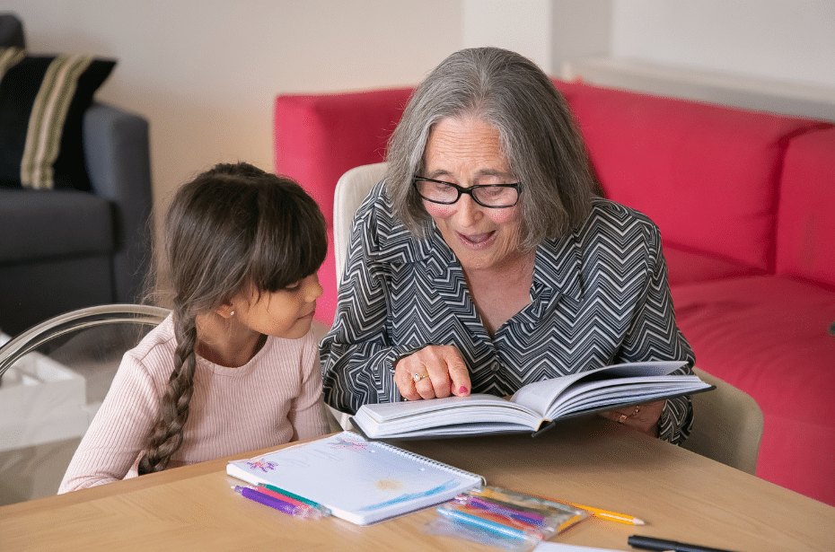 grandparents connect with grandchildren reading story learning colouring