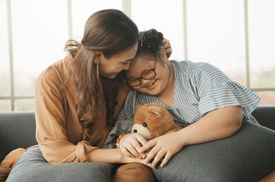 mother daughter planning future safety accessibility embrace hug teddy bear disabled 